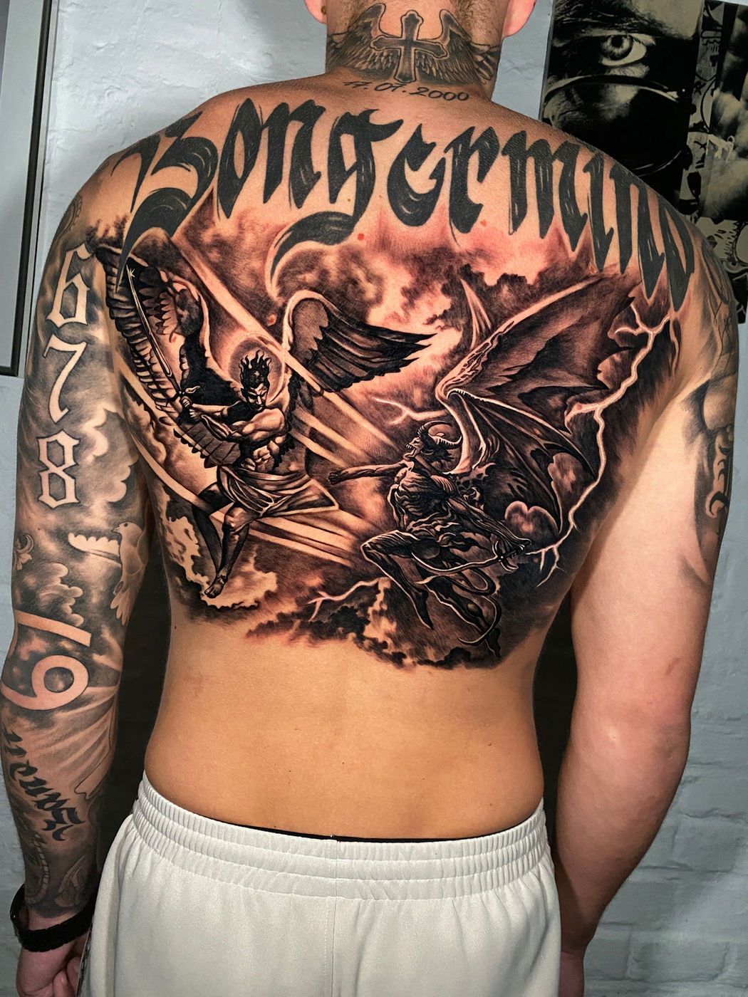 Angel and demon back piece with gothic lettering
